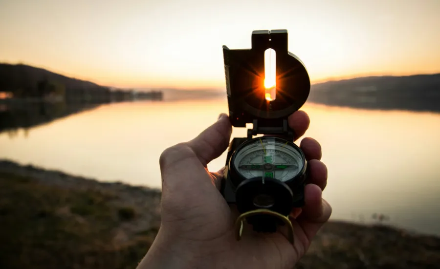 Image of a man using a compass