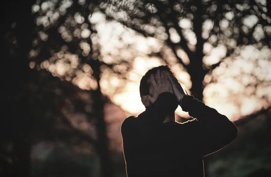 Photo of a man in sorrowful prayer