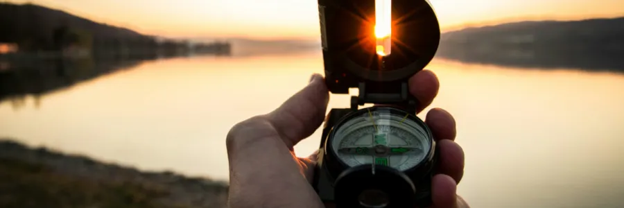 Image of a man using a compass